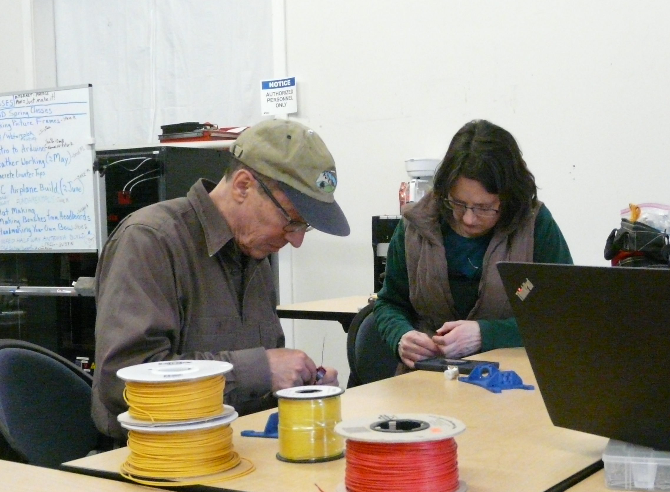 Paul Caldara, K7SHR works on an antenna with Carole Zarrella.